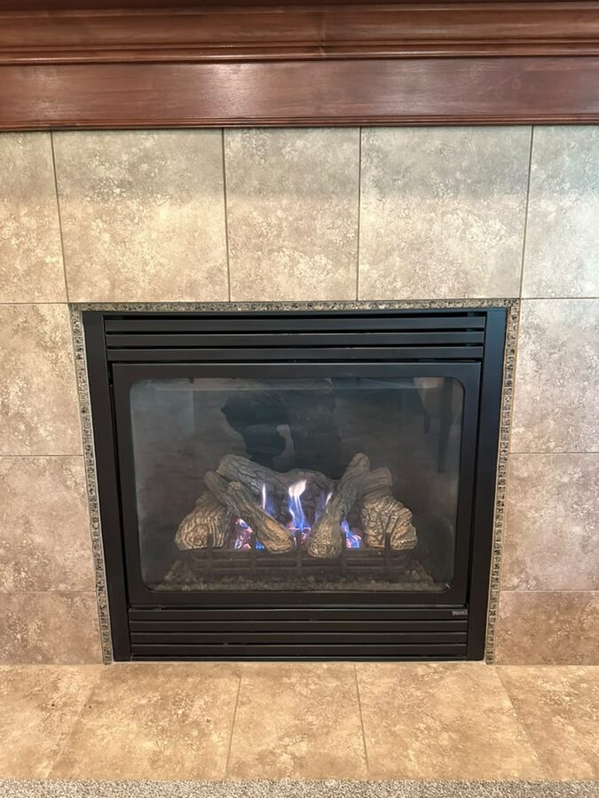 Gas fireplace repaired and glowing warm in a Salt Lake City-area living room